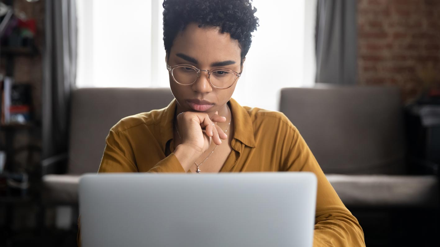 Woman looking at laptop