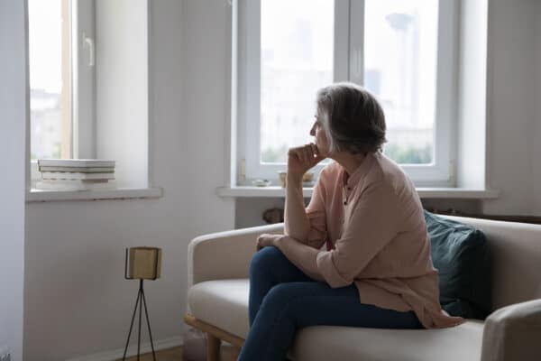 Sad woman looking out the window