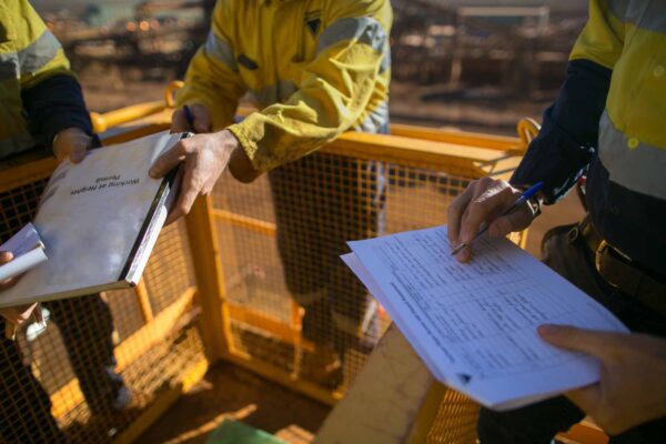 Trained supervisor safety auditor reviewing documents