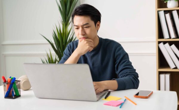Image,Of,Asian,Man,Sitting,At,Home,Working