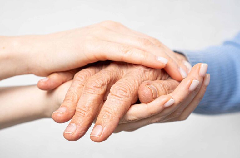 Young hands hold old hands