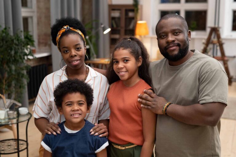 Happy family, dad, mum, and two children