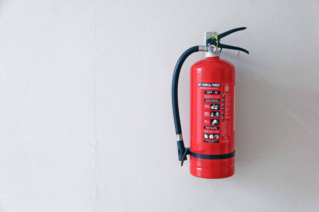 A fire extinguisher on the wall