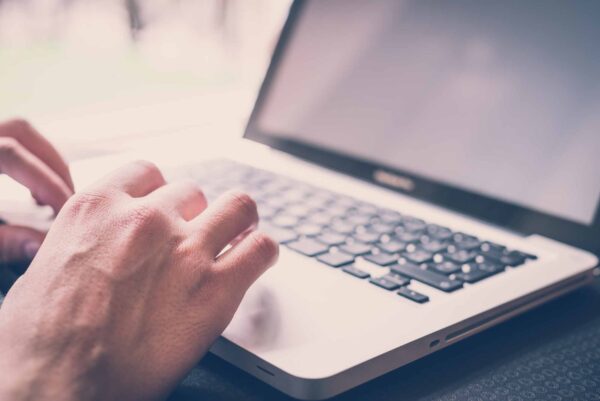 Close up of man using laptop