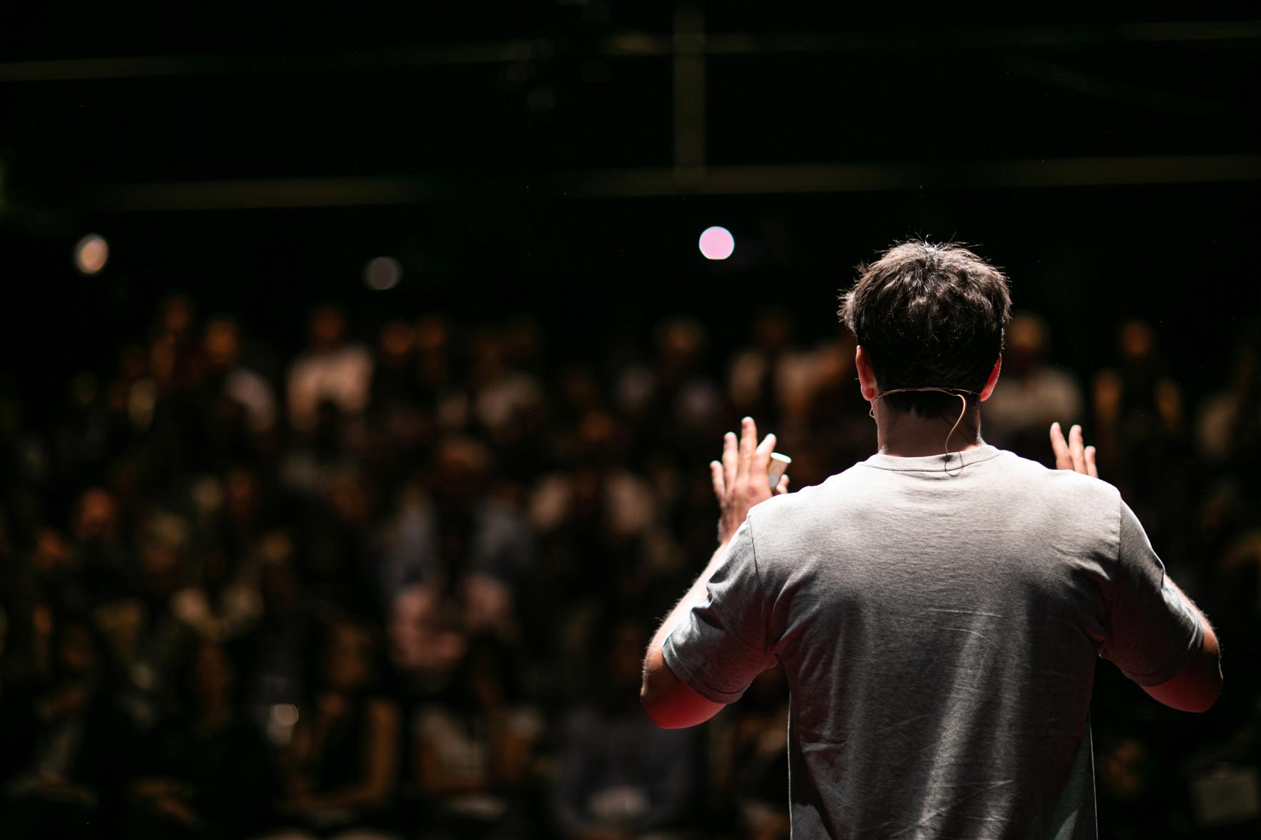 man presenting to a crowd