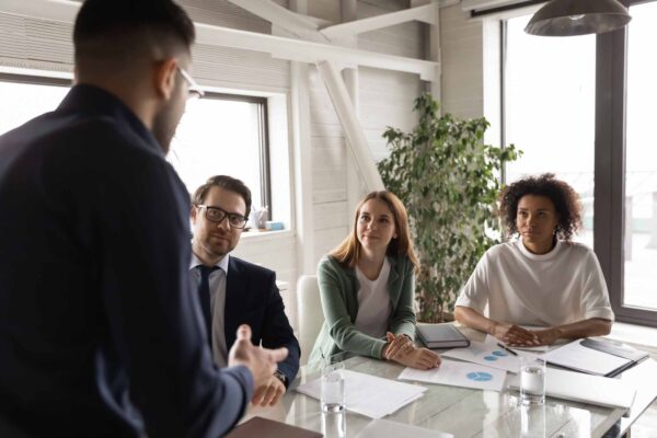 Businessman talk lead meeting with colleagues in office