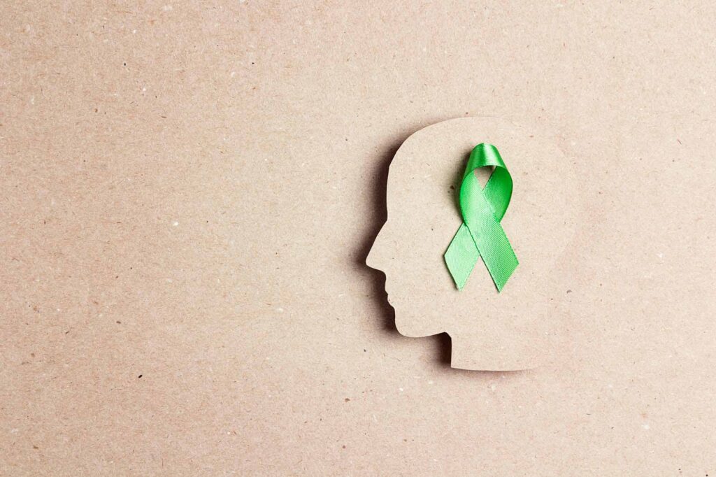 World mental health day concept. Green awareness ribbon