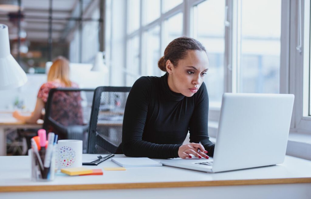 Woman working on laptop in the office