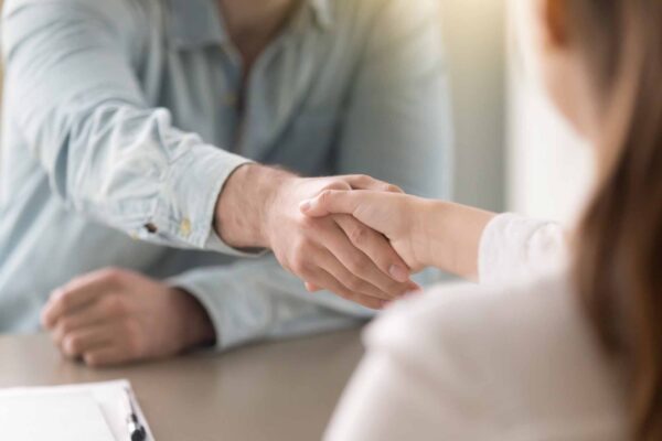 Businessman,Shaking,Female,Hand,Above,The,Table.,Business,Agreement,And