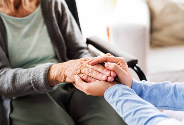 Unrecognizable,Health,Visitor,And,A,Senior,Woman,During,Home,Vis