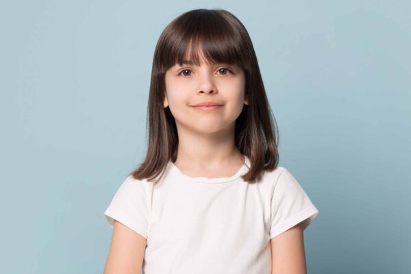 Adorable,Six,Years,Old,Girl,In,White,T-shirt,Isolated,On
