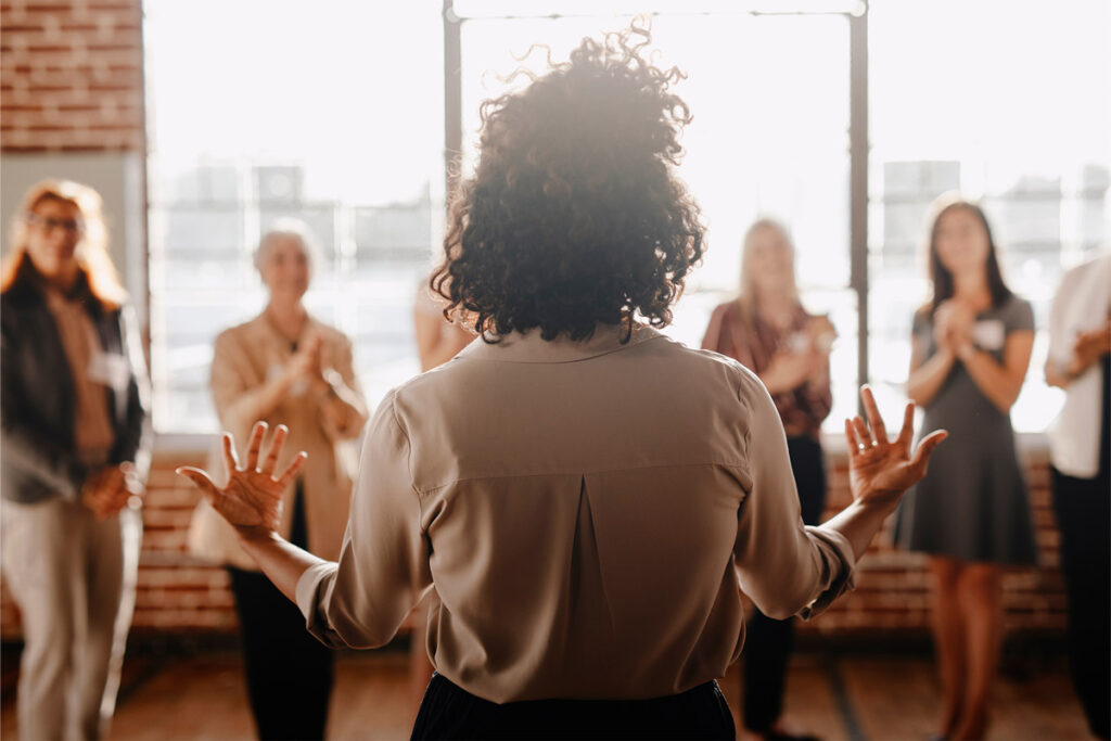 Woman presenting to a group of people