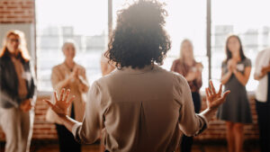 Woman presenting to a group of people