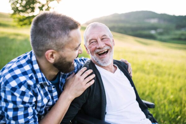 An,Adult,Hipster,Son,With,Senior,Father,In,Wheelchair,On