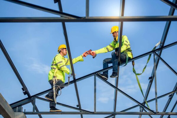 Two,Asian,Construction,Workers,Wore,Safety,Clothing,And,Safety,Harnesses