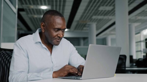 African,American,Businessman,Work,On,Laptop,At,Office,Chatting,Online