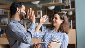 two people high fiving