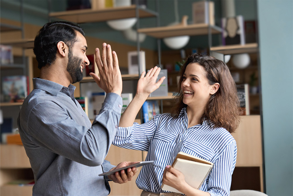 two people high fiving