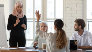 Person raise hand in meeting