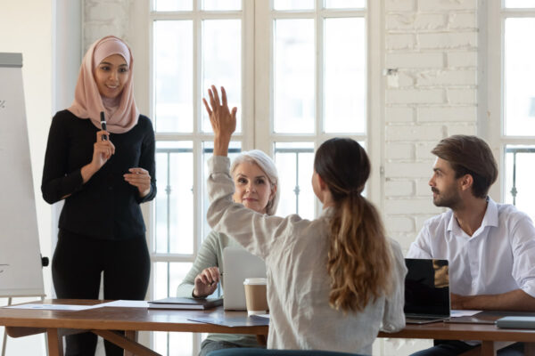 Person raise hand in meeting