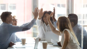 team of people giving high fives