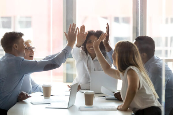 team of people giving high fives