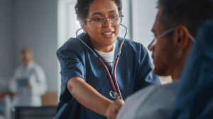 Nurse Listen to Heartbeat and Lungs of Recovering Patient