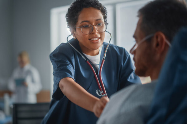 Nurse Listen to Heartbeat and Lungs of Recovering Patient