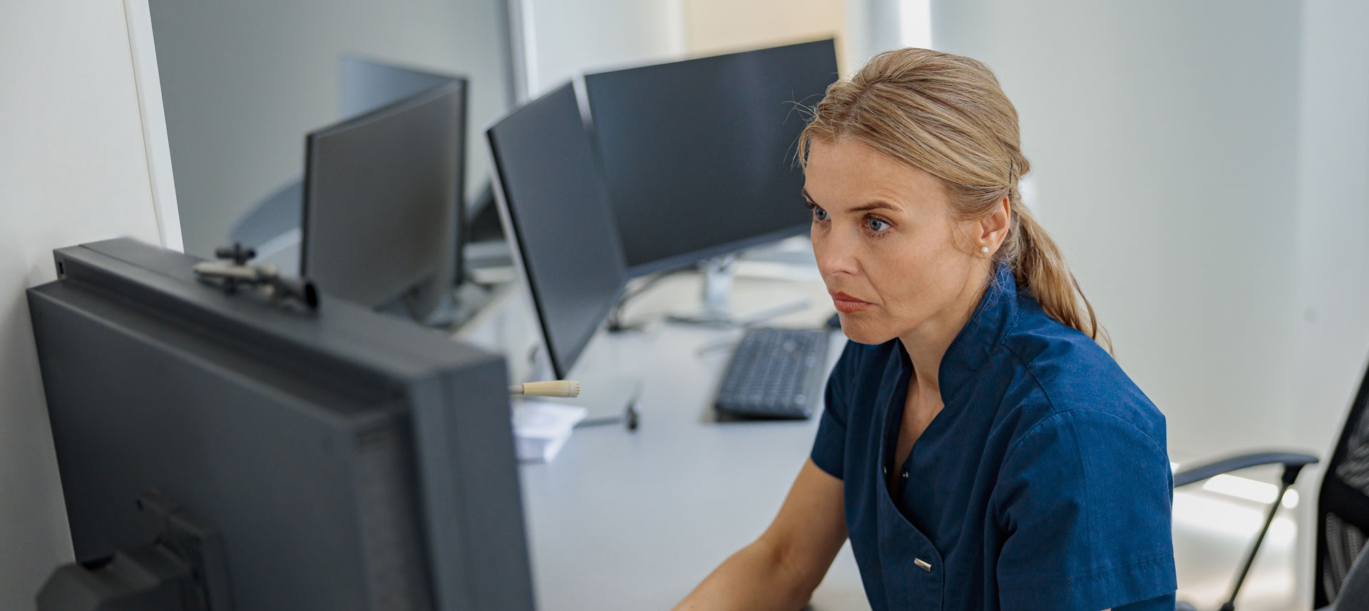 medical professional working on a computer