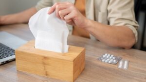 Person grabbing a tissue