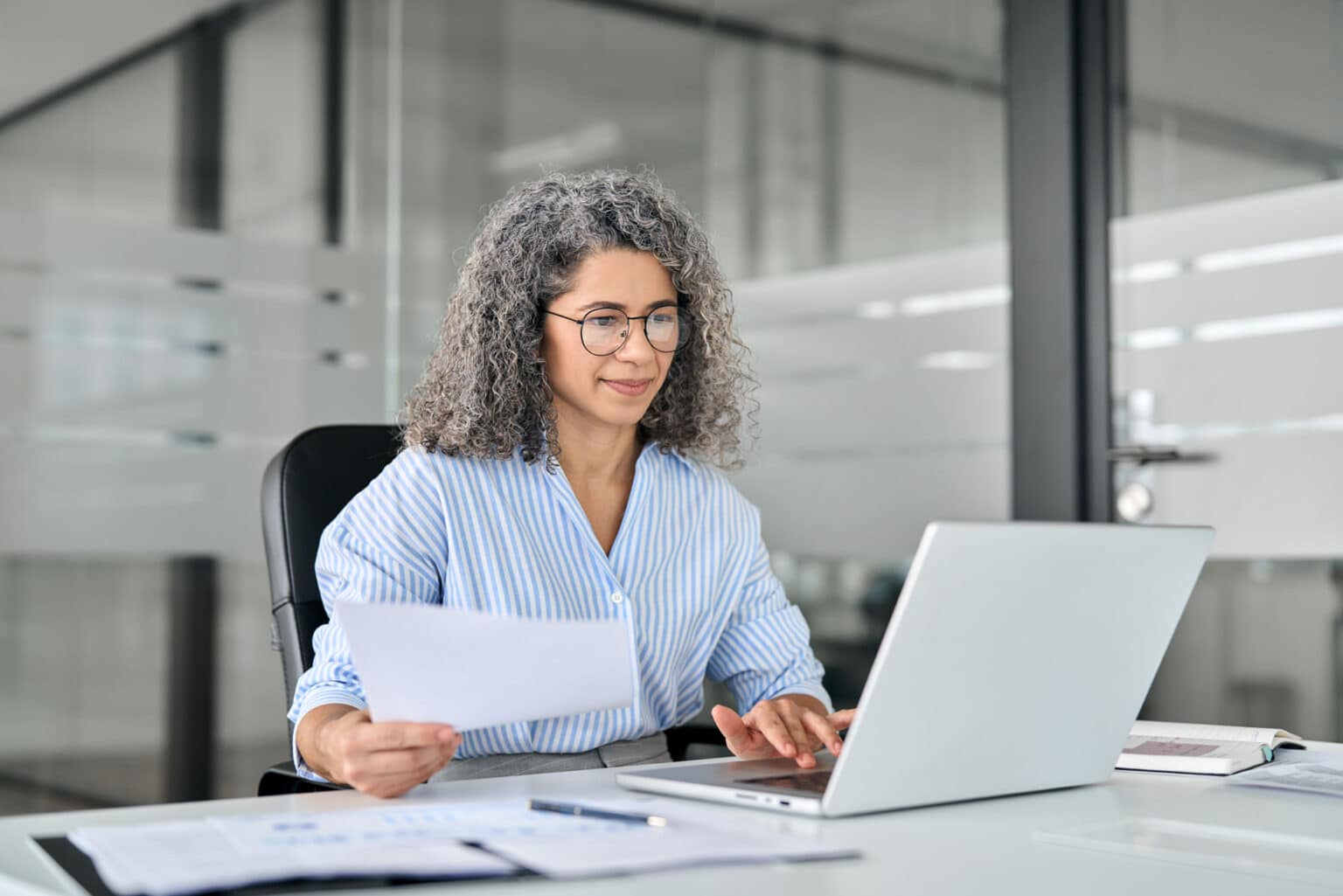 Person working on a laptop in the office