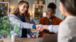 Business women shaking hands