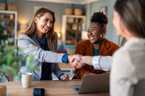 Business women shaking hands