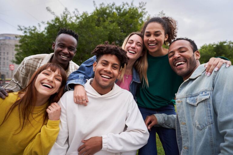 A group of University students smiling