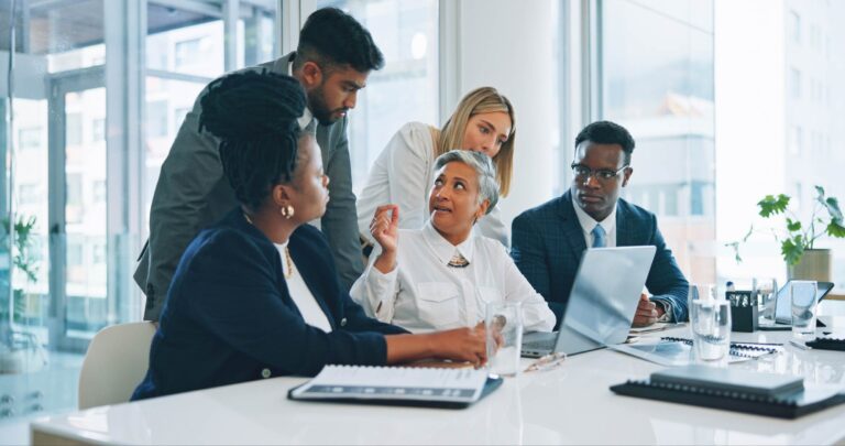 A group of people in a meeting
