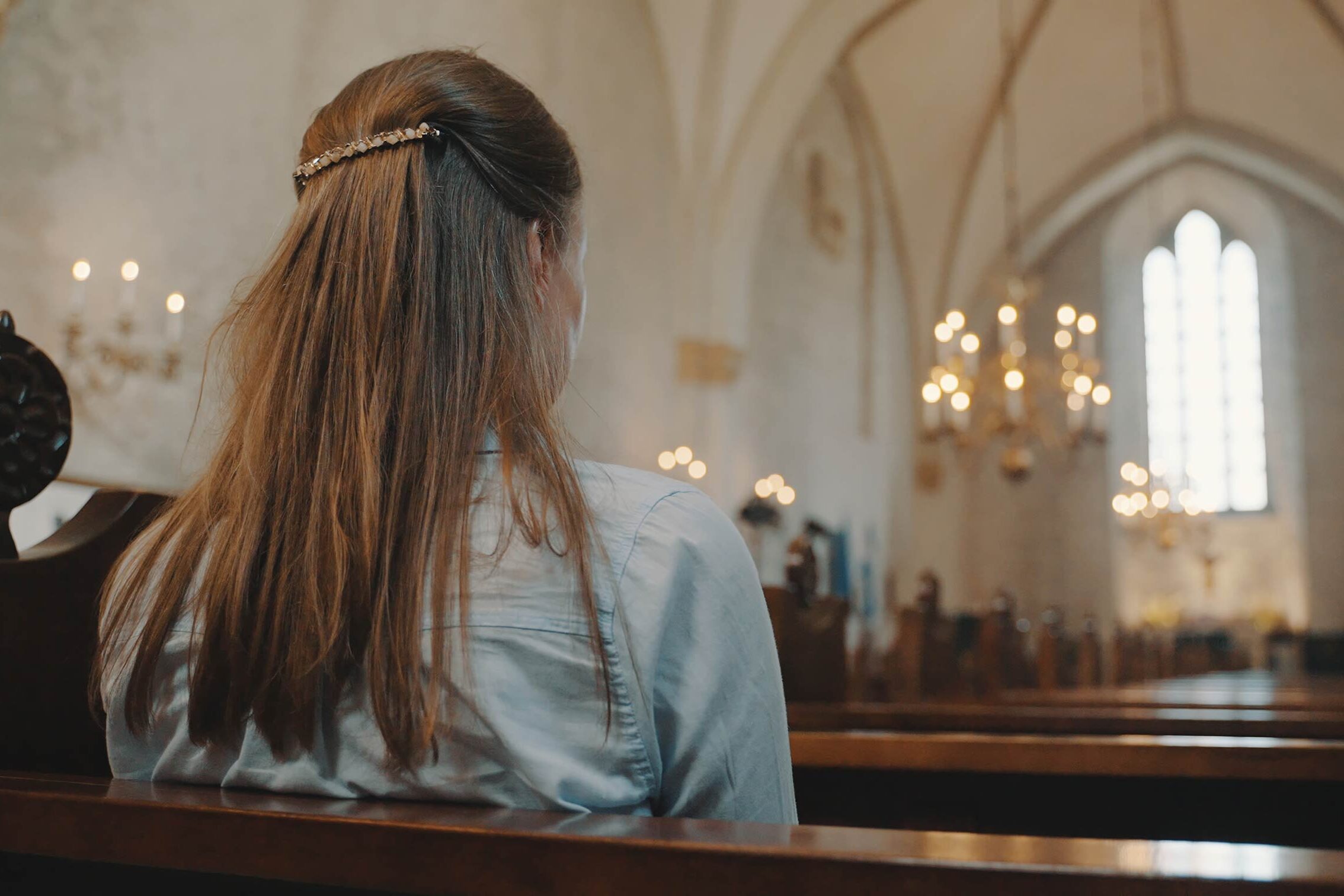 woman sitting in church