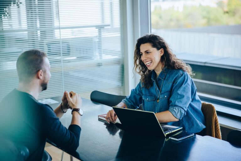 two people sitting at table