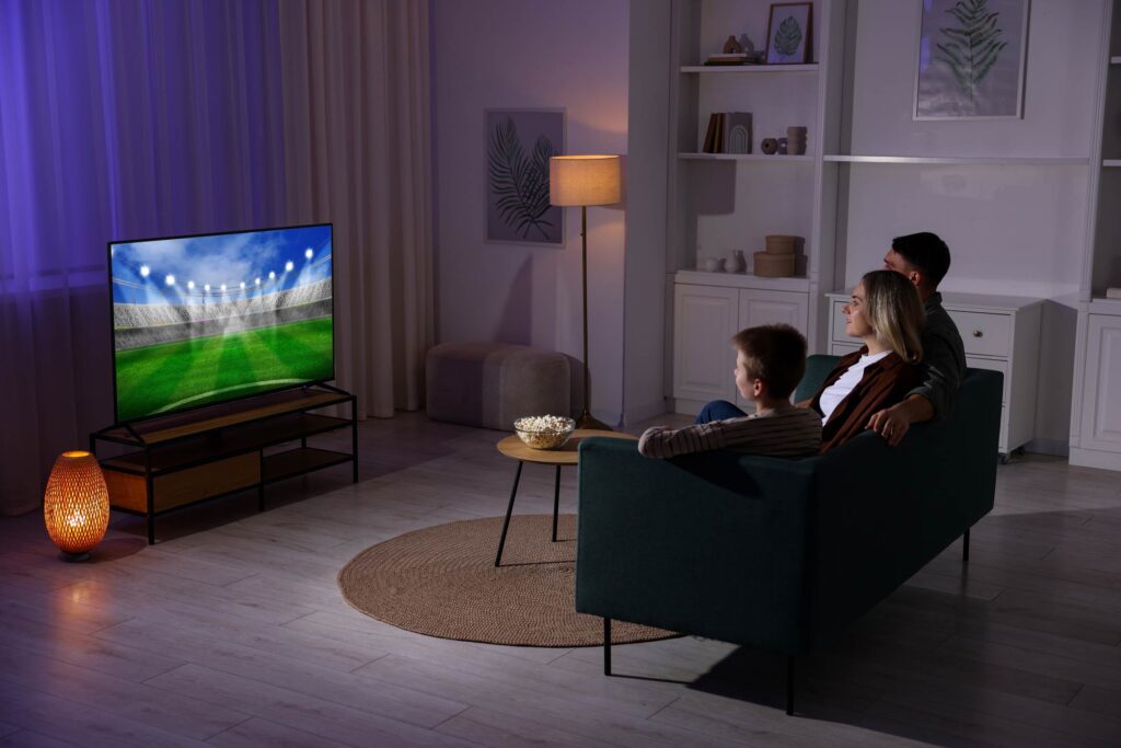 Family sitting and watching the TV