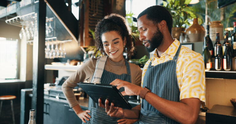 Hospitality staff looking at tablet