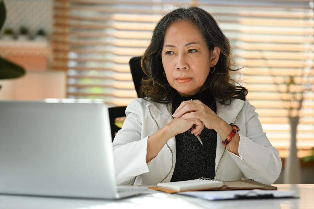 Woman looking at laptop